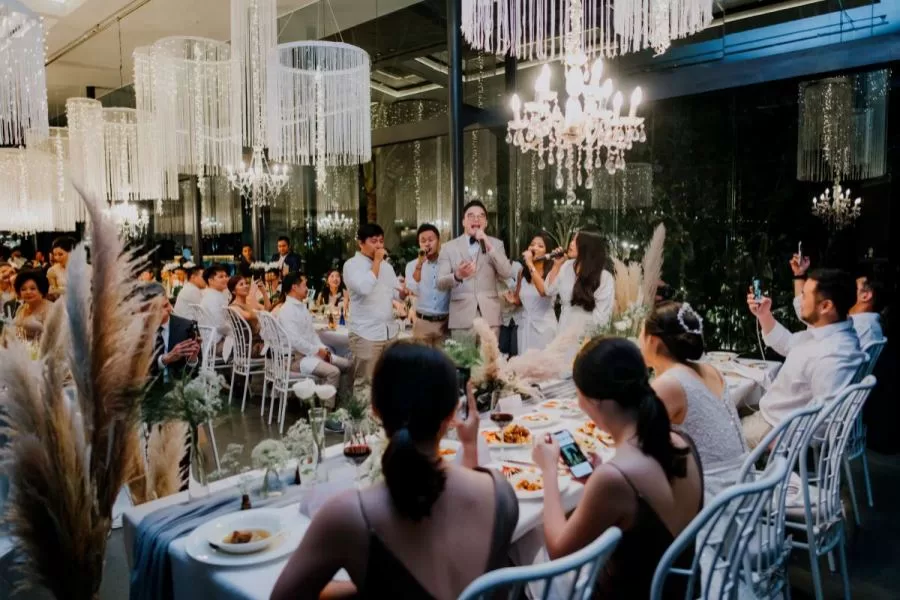Guests enjoying entertainment at a Tirtha Bali's wedding reception venue