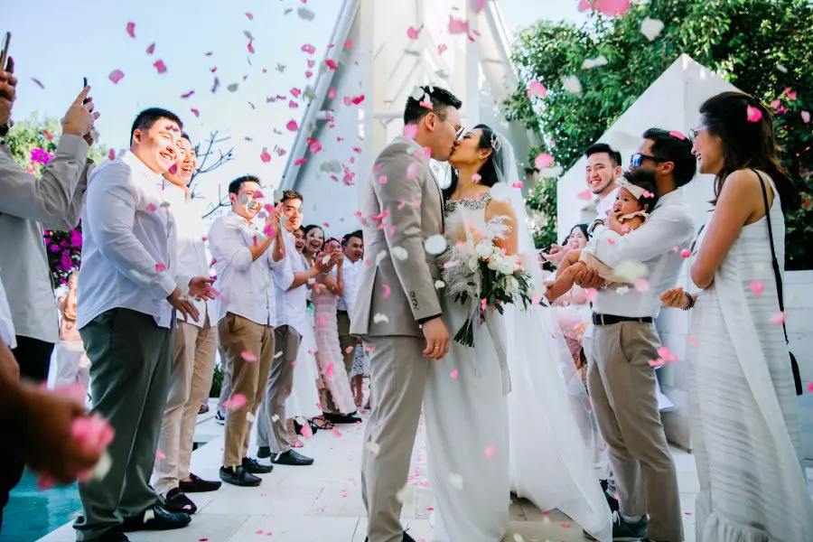 Flower shower on the wedding day of a real wedding couple