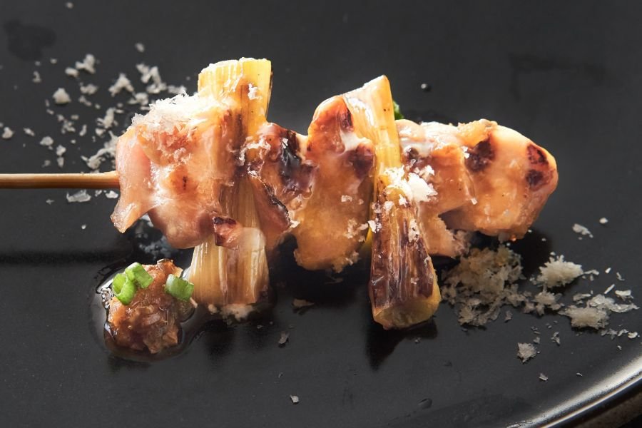 Delicious Yakitori on a black plate