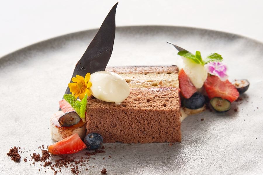 Chocolate and pistachio mousse in Raspberry sauce