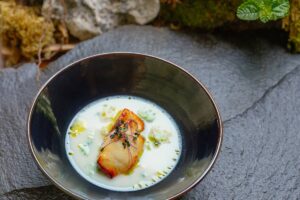 A refined Japanese-French fusion dish featuring delicate textures and elegant presentation by Chef Ryoichi Kano.