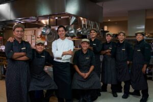 Chef Ryoichi Kano with the Tirtha Dining kitchen team, showcasing a collaborative spirit and culinary excellence in Bali.