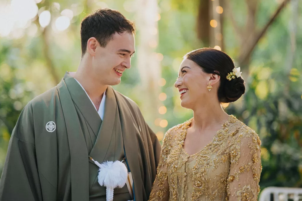 Rachel and Yugo in traditional attire at their Bali wedding in Tirtha Uluwatu.
