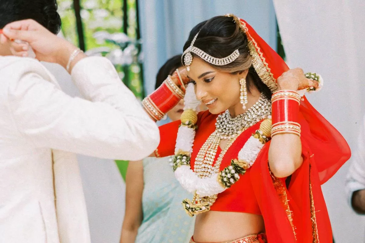 Indian Hindu Wedding in Bali with Tirtha, wedding reception, exchange of garland, all inclusive bali wedding package, bali wedding venue, bali destination wedding, best wedding venue in bali, Tirtha Bali wedding planner