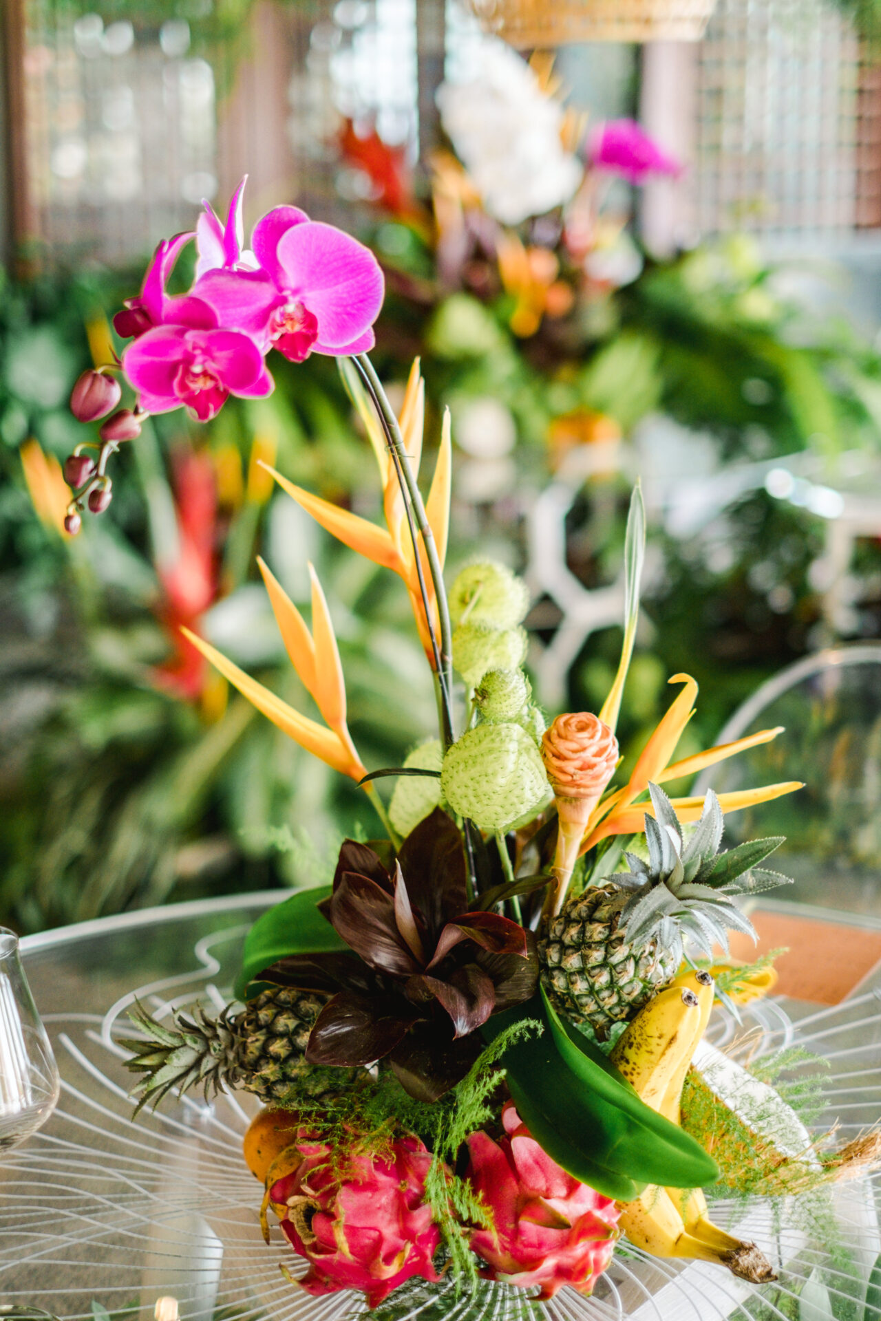 A vibrant centerpiece of orchids and tropical fruits, crafted from locally grown elements to celebrate Bali’s natural beauty.