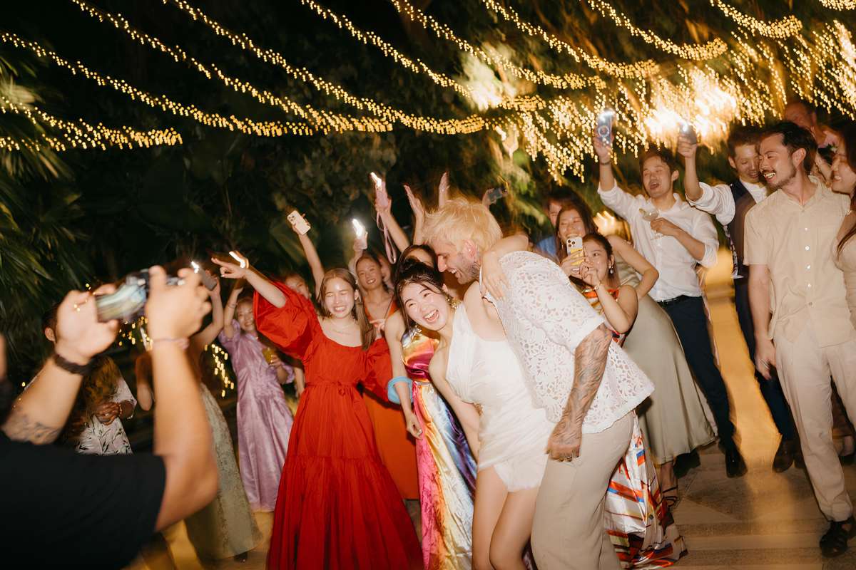 Akari & Michaljon celebrate on the dance floor with guests during their after party at Tirtha Bali.