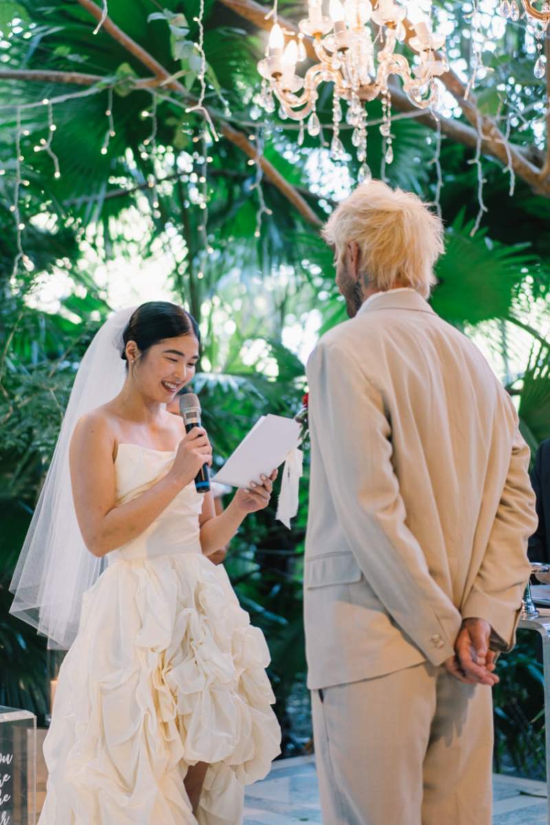 Akari reads her vows to Michaljon at their wedding ceremony in Moonlight Garden, a wedding venue by Tirtha Bali.