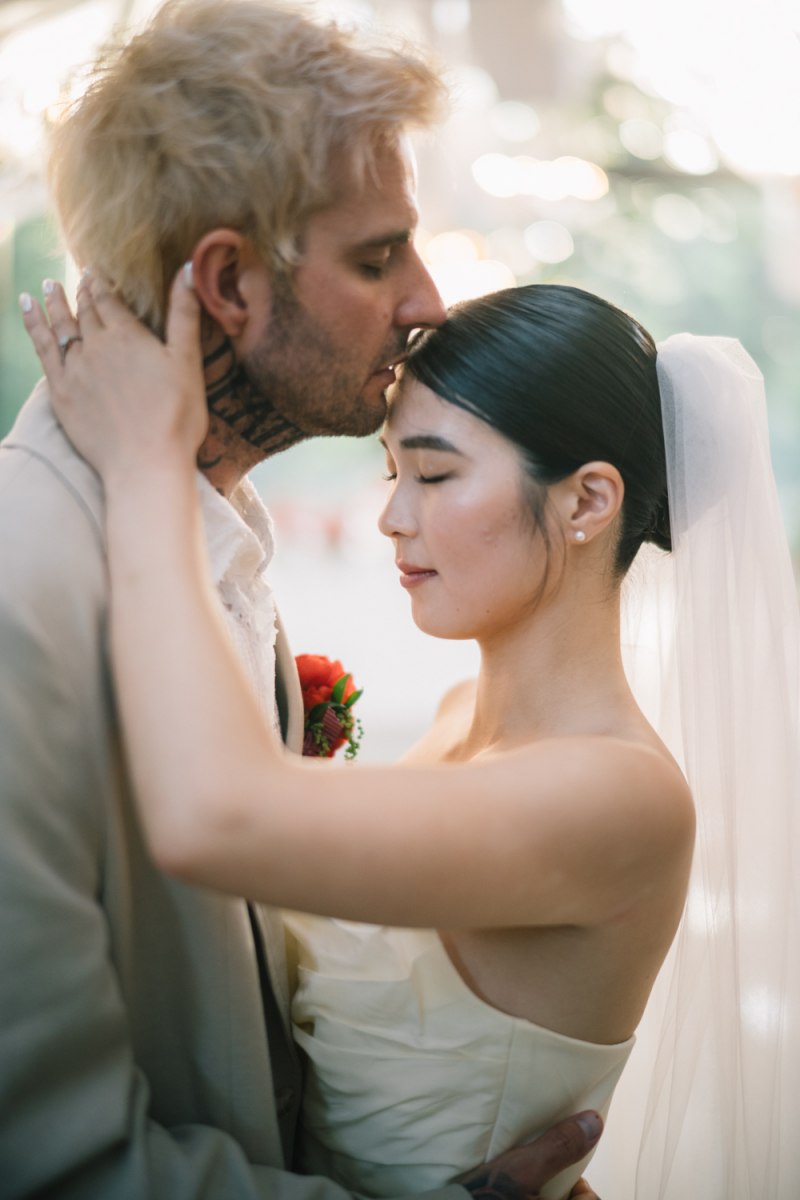 The couple share a quiet embrace in the Plumeria Room at Tirtha Bali.