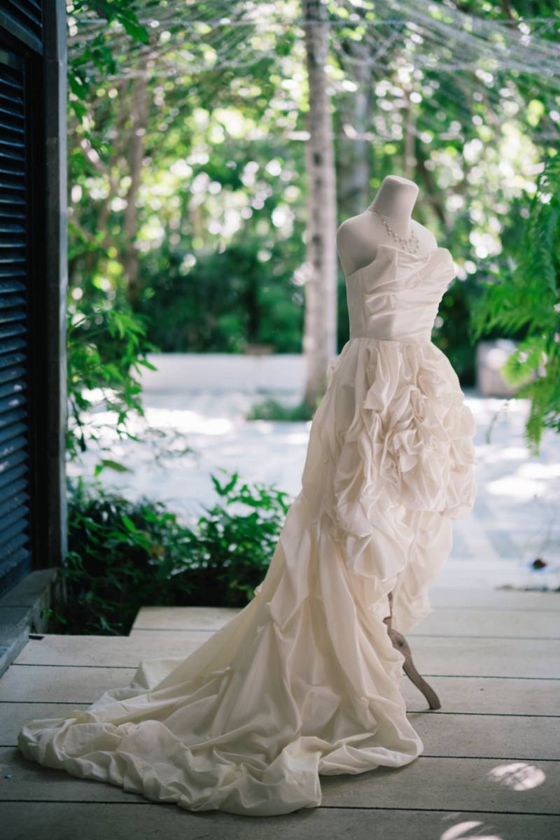 Akari’s wedding dress displayed in soft tropical light.