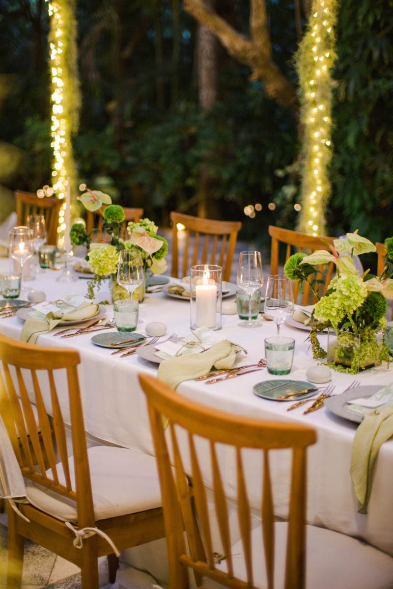 Elegant dinner setup with green wedding decor in Moonlight Garden at Tirtha Bali.