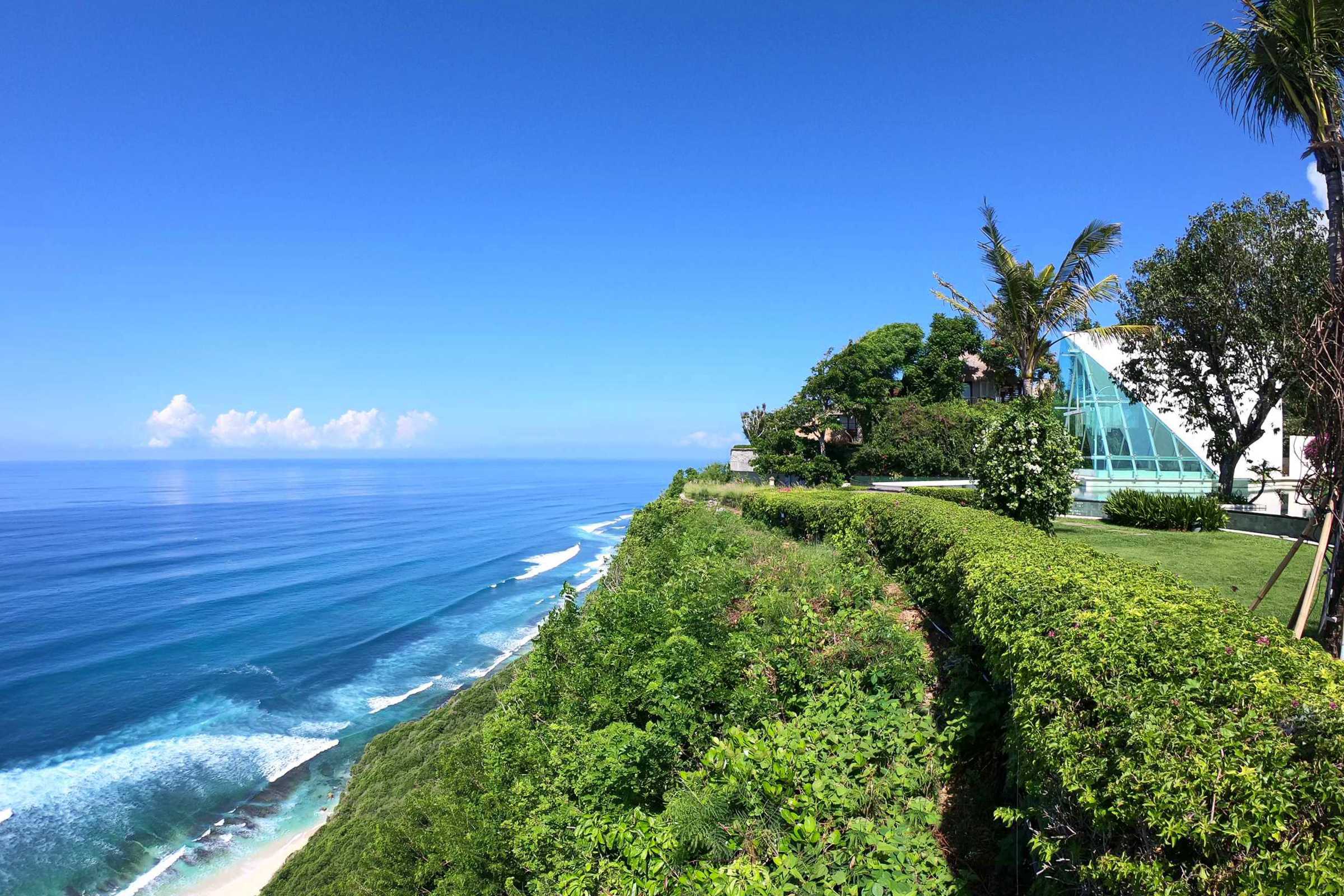 Glass wedding chapel on Bali clifftop overlooking the Indian Ocean at Tirtha Uluwatu.