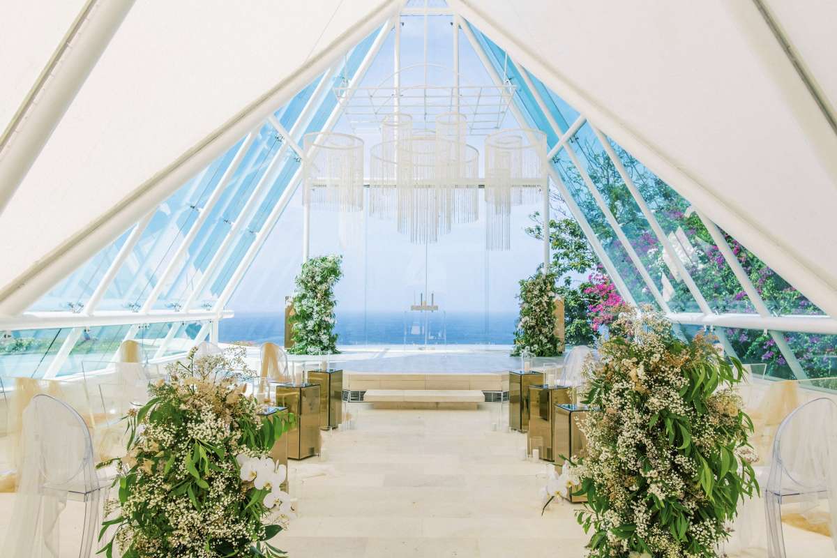 Tirtha Uluwatu's iconic Glass Chapel wedding venue for a Bali destination wedding ceremony.