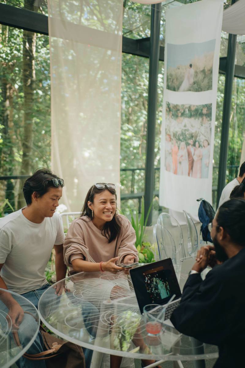Couple chatting with Tirtha Bali’s in-house photo-videographer about creative ideas.