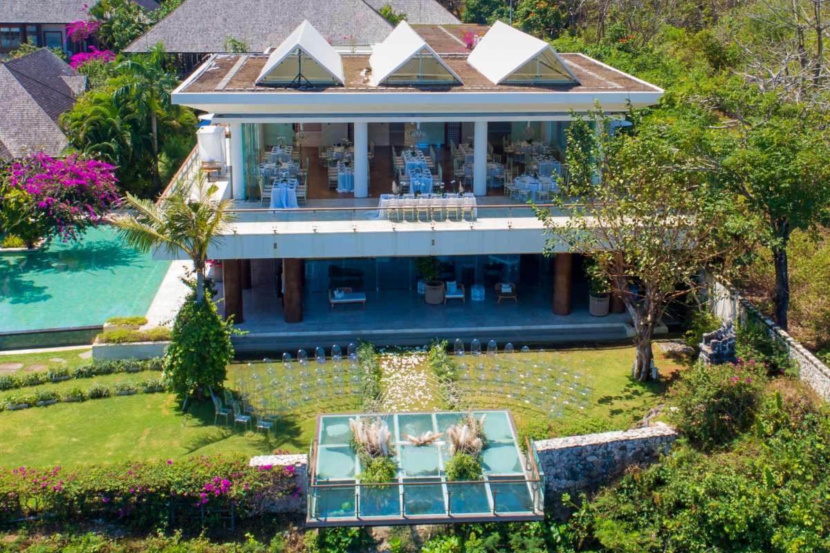Heaven Room exterior view with cliffside ceremony setup and ocean-facing glass stage in Bali.