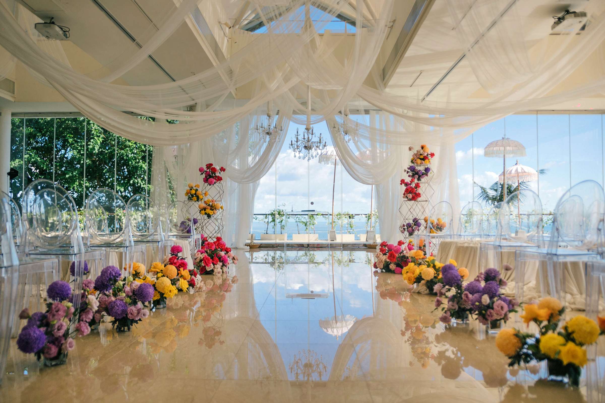 Heaven Room, an ocean view wedding venue, with floral aisle setup.