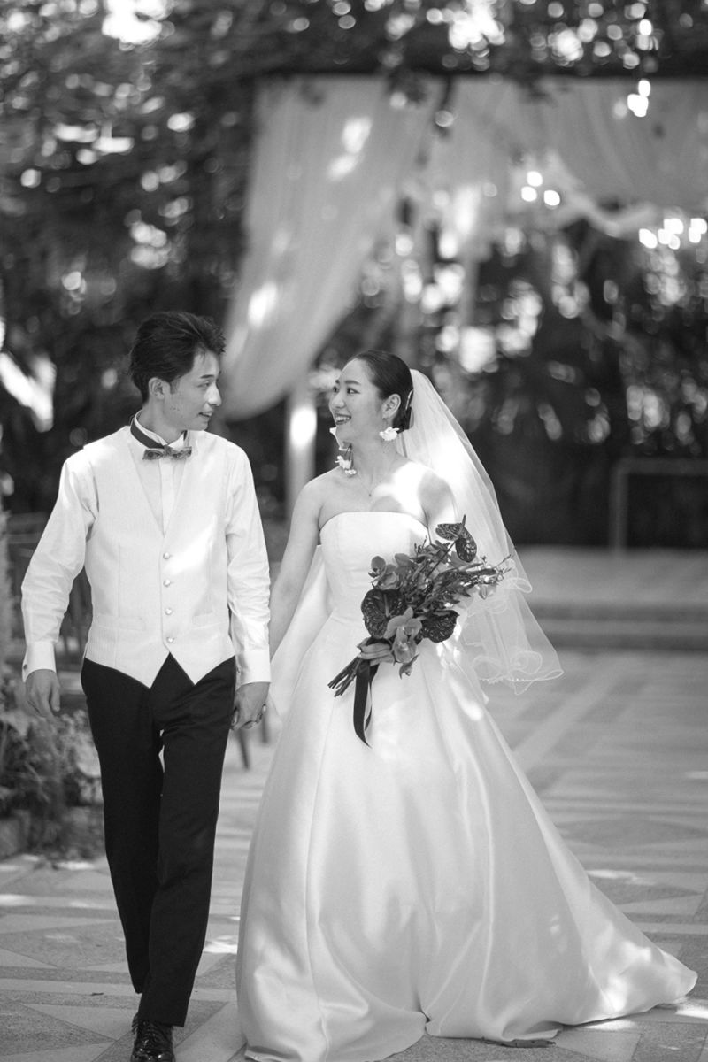 Couple walking back down the aisle smiling after wedding ceremony at The Moonlight Garden.