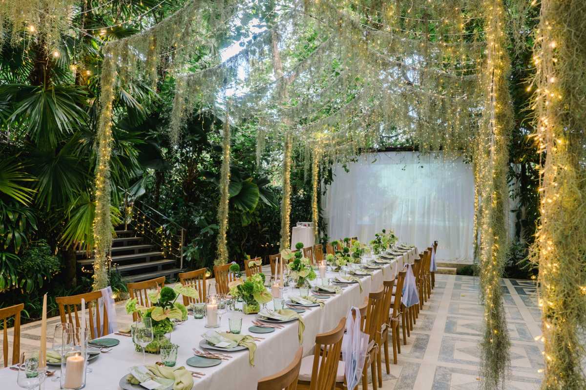 Long table dinner under twinkling canopy at Moonlight Garden, a garden wedding venue by Tirtha Bali