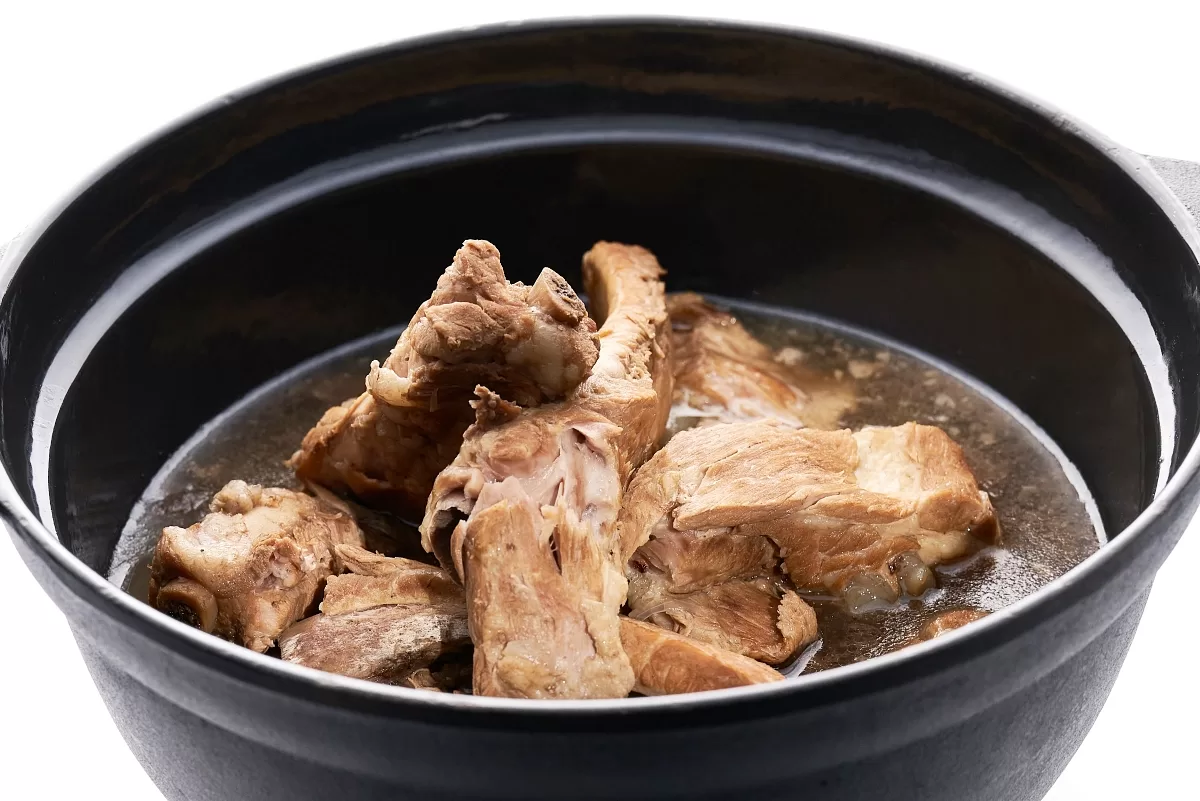 Bak kut teh with tender pork ribs simmered in a savory broth.
