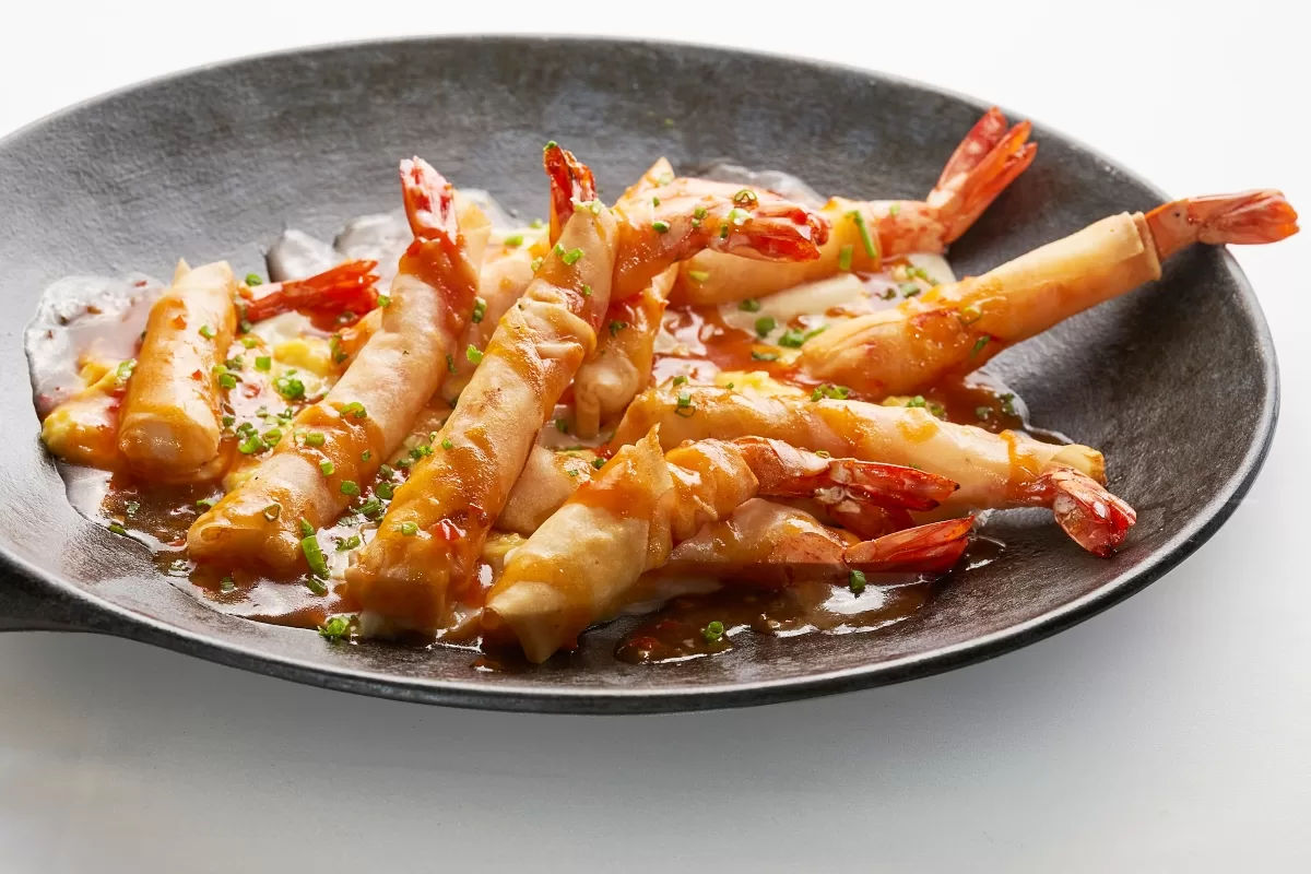 Deep fried prawn wrapped in pastry and served with tangy chili sauce.