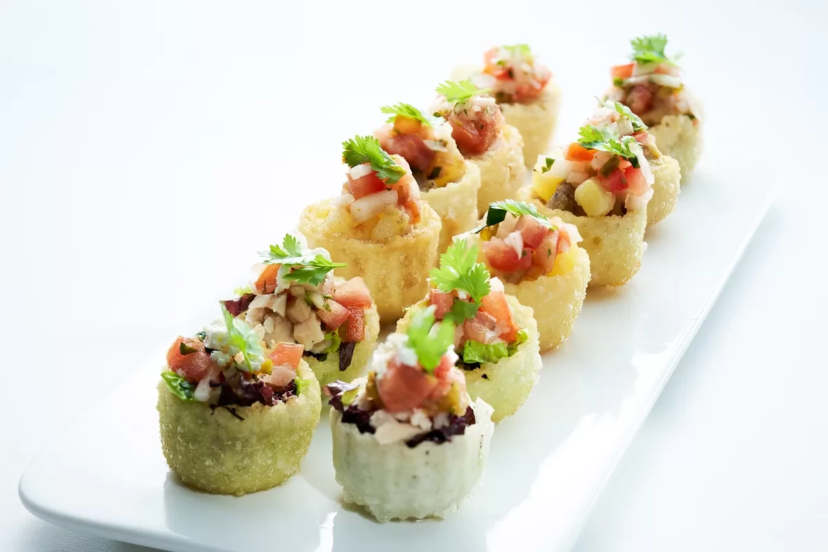 Mexican canapés or sopes made with crispy pastry cups filled with diced vegetables.